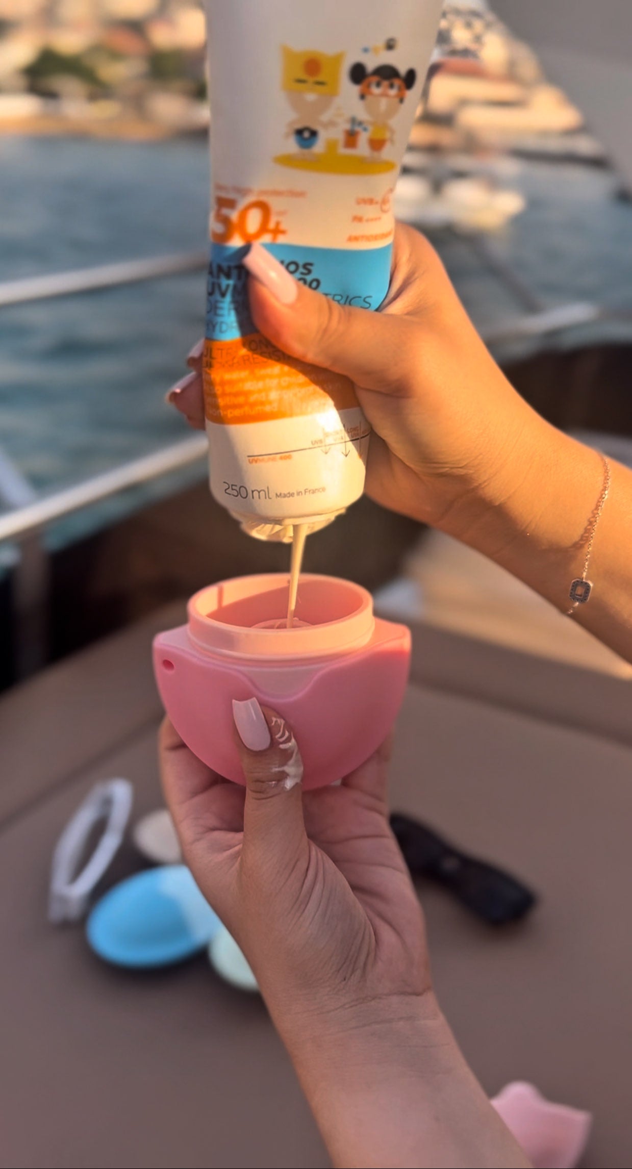 Pink sunscreen applicator with sponge tip for smooth, even, and mess-free sunscreen application, ideal for kids and adults